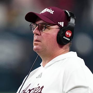 Dec 27, 2024; Las Vegas, NV, USA; Texas A&M Aggies head coach Mike Elko reacts against the Southern California Trojans in the second half at Allegiant Stadium. Mandatory Credit: Kirby Lee-Imagn Images