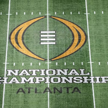 Jan 19, 2025; Atlanta, GA, USA; The College Football Playoff National Championship logo at midfield at Mercedes-Benz Stadium, the site of the 2025 College Football Playoff National Championship between the Ohio State Buckeyes and the Notre Dame Fighting Irish. 