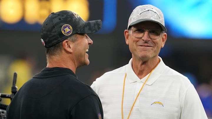 Baltimore Ravens coach John Harbaugh with brother and Los Angeles Chargers coach Jim Harbaugh before the game at SoFi Stadium.