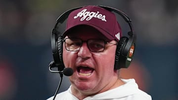 Dec 27, 2024; Las Vegas, NV, USA; Texas A&M Aggies head coach Mike Elko reacts against the Southern California Trojans in the second half at Allegiant Stadium. Mandatory Credit: Kirby Lee-Imagn Images