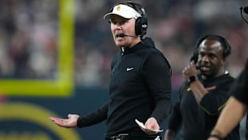Dec 27, 2024; Las Vegas, NV, USA; Southern California Trojans head coach Lincoln Riley reacts against the Texas A&M Aggies in the first half at Allegiant Stadium. Mandatory Credit: Kirby Lee-Imagn Images