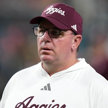 Dec 27, 2024; Las Vegas, NV, USA; Texas A&M Aggies head coach Mike Elko reacts against the Southern California Trojans in the first half at Allegiant Stadium. Mandatory Credit: Kirby Lee-Imagn Images