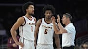Feb 15, 2025; Los Angeles, California, USA; Southern California Trojans head coach Eric Musselman (right) talks with guard Desmond Claude (1) and guard Wesley Yates III (6) against the Minnesota Golden Gophers in the first half at Galen Center. Mandatory Credit: Kirby Lee-Imagn Images