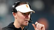 Dec 27, 2024; Las Vegas, NV, USA; Southern California Trojans head coach Lincoln Riley reacts against the Texas A&M Aggies in the second half at Allegiant Stadium. Mandatory Credit: Kirby Lee-Imagn Images