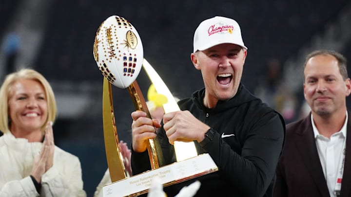 Dec 27, 2024; Las Vegas, NV, USA; Southern California Trojans head coach Lincoln Riley holds the championship trophy after the game against the Texas A&M Aggies at Allegiant Stadium. Mandatory Credit: Kirby Lee-Imagn Images