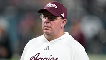 Dec 27, 2024; Las Vegas, NV, USA; Texas A&M Aggies head coach Mike Elko reacts against the Southern California Trojans in the first half at Allegiant Stadium. Mandatory Credit: Kirby Lee-Imagn Images