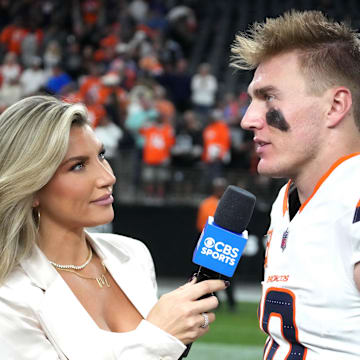 Nov 24, 2024; Paradise, Nevada, USA; CBS Sports reporter Melanie Collins (left) interviews Denver Broncos quarterback Bo Nix (10) after the game against the Las Vegas Raiders at Allegiant Stadium. Mandatory Credit: Kirby Lee-Imagn Images