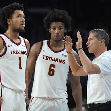  Desmond Claude (1) and guard Wesley Yates III (6) listen to direction s from their former coach, USC's Eric Musselman. 