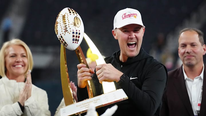 Southern California Trojans head coach Lincoln Riley holds the championship trophy after the game against the Texas A&M Aggies at Allegiant Stadium. Southern California Trojans head coach Lincoln Riley holds the championship trophy after the game against the Texas A&M Aggies at Allegiant Stadium.