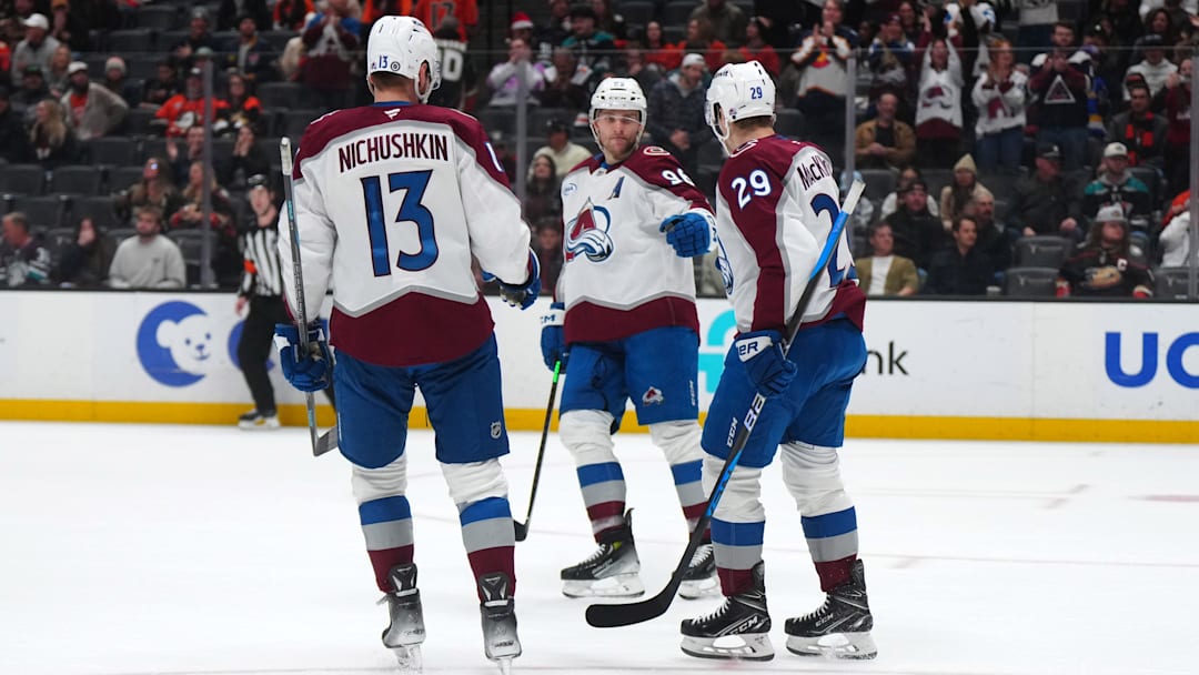 Dec 20, 2024; Anaheim, California, USA; Colorado Avalanche right wing Valeri Nichushkin (13), right wing Mikko Rantanen (96) and center Nathan MacKinnon (29) celebrate after an empty net goal against the Anaheim Ducks in the third period at Honda Center. Mandatory Credit: Kirby Lee-Imagn Images