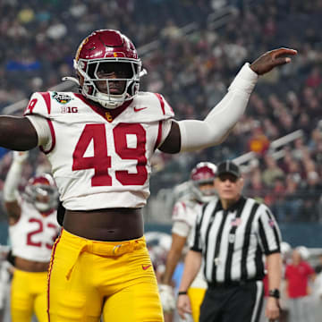 Dec 27, 2024; Las Vegas, NV, USA; Southern California Trojans defensive end Kameryn Fountain (49) celebrates against the Texas A&M Aggies in the first half at Allegiant Stadium. Mandatory Credit: Kirby Lee-Imagn Images