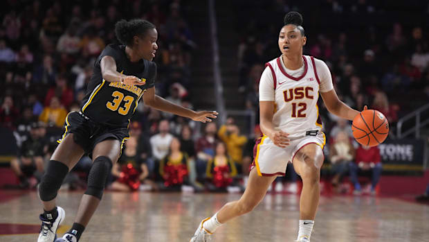 Dec 29, 2024; Los Angeles, California, USA; Southern California Trojans guard JuJu Watkins (12) dribbles the ball against Mic