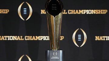 The College Football Playoff National Championship trophy at a press conference