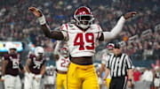 Dec 27, 2024; Las Vegas, NV, USA; Southern California Trojans defensive end Kameryn Fountain (49) celebrates against the Texas A&M Aggies in the first half at Allegiant Stadium. Mandatory Credit: Kirby Lee-Imagn Images