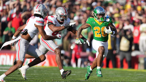Jan 1, 2025; Pasadena, California, USA; Oregon Ducks running back Jordan James (20) carries the ball against Ohio State Bucke