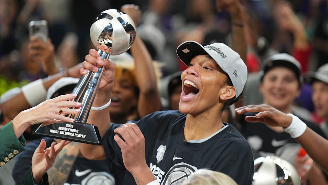 Oct 10, 2025; Phoenix, Arizona, USA; Las Vegas Aces center A'ja Wilson (22) celebrates with teammates after game four of the 2025 WNBA Finals at Mortgage Matchup Center. Mandatory Credit: Joe Camporeale-Imagn Images