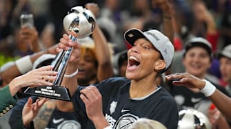 Oct 10, 2025; Phoenix, Arizona, USA; Las Vegas Aces center A'ja Wilson (22) celebrates with teammates after game four of the 2025 WNBA Finals at Mortgage Matchup Center. Mandatory Credit: Joe Camporeale-Imagn Images