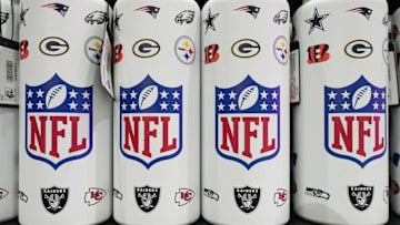 NFL shield logo water bottles at the NFL Shop at the Super Bowl LIX Experience.