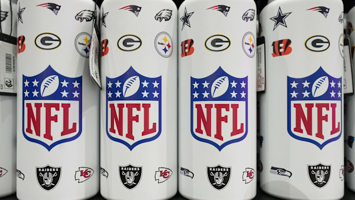 NFL shield logo water bottles at the NFL Shop at the Super Bowl LIX Experience.