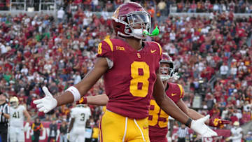 Nov 30, 2024; Los Angeles, California, USA; Southern California Trojans wide receiver Ja'Kobi Lane (8) celebrates after scoring on a 6-yard touchdown reception against the Notre Dame Fighting Irish in the second half at United Airlines Field at Los Angeles Memorial Coliseum. Mandatory Credit: Kirby Lee-Imagn Images
