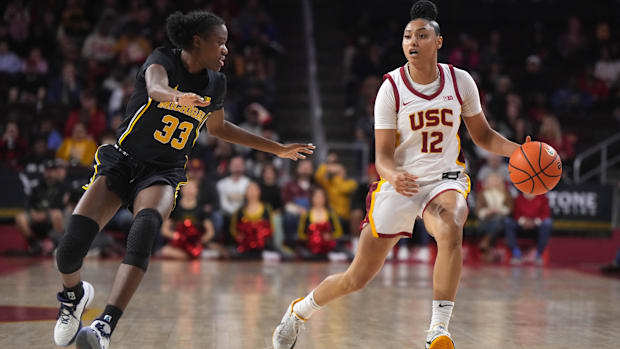 Dec 29, 2024; Los Angeles, California, USA; Southern California Trojans guard JuJu Watkins (12) dribbles the ball against Mic