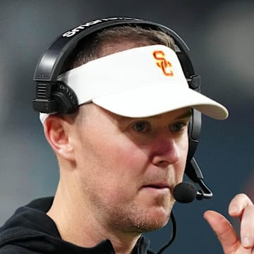 Dec 27, 2024; Las Vegas, NV, USA; Southern California Trojans head coach Lincoln Riley reacts against the Texas A&M Aggies in the second half at Allegiant Stadium. Mandatory Credit: Kirby Lee-Imagn Images
