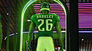 Feb 4, 2025; New Orleans, LA, USA; A Nike football display featuring the uniform and helmet of Philadelphia Eagles running back Saquon Barkley (26) at the NFL Shop at the Super Bowl LIX Experience at the Ernest N. Morial Convention Center. Mandatory Credit: Kirby Lee-Imagn Images