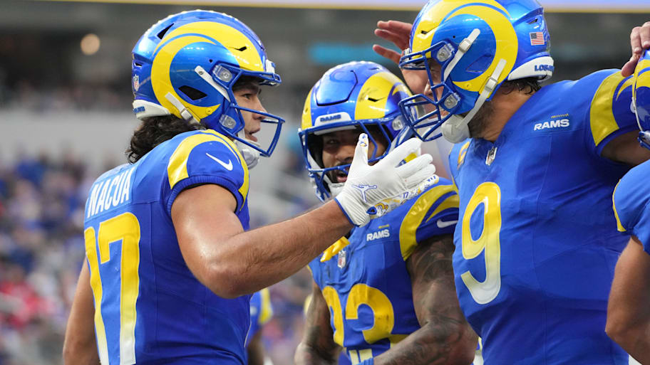 Dec 8, 2024; Inglewood, California, USA; Los Angeles Rams wide receiver Puka Nacua (17) celebrates with quarterback Matthew Stafford (9) and running back Kyren Williams (23) after scoring a touchdown run in the second quarter against the Buffalo Bills at SoFi Stadium. Mandatory Credit: Kirby Lee-Imagn Images | Kirby Lee-Imagn Images