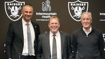 Las Vegas Raiders general manager John Spytek, owner Mark Davis and coach Pete Carroll pose at press conference