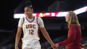 Dec 10, 2024; Los Angeles, California, USA; Southern California Trojans guard JuJu Watkins (12) celebrates with head coach Lindsay Gottlieb in the fourth quarter against the Fresno State Bulldogs at Galen Center. USC defeated Fresno State 89-40. Mandatory Credit: Kirby Lee-Imagn Images