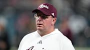 Dec 27, 2024; Las Vegas, NV, USA; Texas A&M Aggies head coach Mike Elko reacts against the Southern California Trojans in the first half at Allegiant Stadium. Mandatory Credit: Kirby Lee-Imagn Images