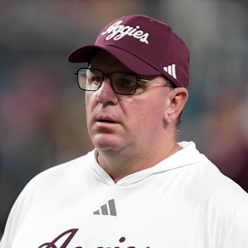 Dec 27, 2024; Las Vegas, NV, USA; Texas A&M Aggies head coach Mike Elko reacts against the Southern California Trojans in the first half at Allegiant Stadium. Mandatory Credit: Kirby Lee-Imagn Images
