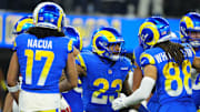Dec 28, 2024; Inglewood, California, USA; Los Angeles Rams running back Kyren Williams (23) celebrates with wide receiver Jordan Whittington (88) and wide receiver Puka Nacua (17) after scoring on a 1-yard touchdown run against the Arizona Cardinals in the first half at SoFi Stadium. Mandatory Credit: Kirby Lee-Imagn Images