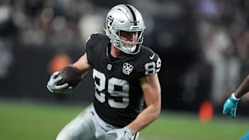 Dec 22, 2024; Paradise, Nevada, USA; Las Vegas Raiders tight end Brock Bowers (89) carries the ball against the Jacksonville Jaguars in the second half at Allegiant Stadium. Mandatory Credit: Kirby Lee-Imagn Images