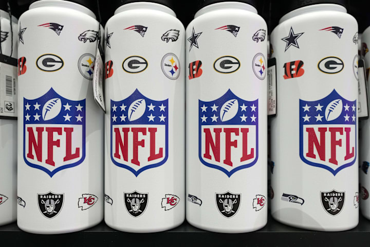 NFL shield logo water bottles at the NFL Shop at the Super Bowl LIX Experience at the Ernest N. Morial Convention Center. 