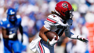 Sep 7, 2024; Lexington, Kentucky, USA; South Carolina Gamecocks wide receiver Jared Brown (14) runs the ball during the first quarter against the Kentucky Wildcats at Kroger Field. Mandatory Credit: Jordan Prather-Imagn Images