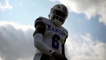 Sep 6, 2025; Columbia, Missouri, USA; Kansas Jayhawks quarterback Jalon Daniels (6) walks off the field during the first half against the Missouri Tigers at Faurot Field at Memorial Stadium. Mandatory Credit: Jay Biggerstaff-Imagn Images