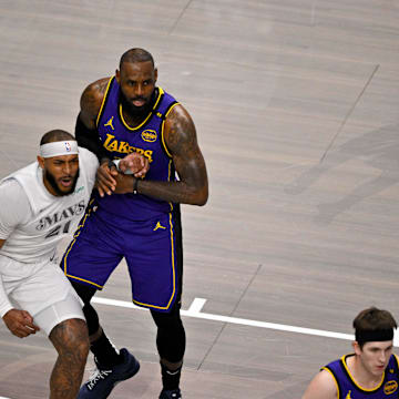 Apr 9, 2025; Dallas, Texas, USA; Dallas Mavericks center Daniel Gafford (21) and Los Angeles Lakers forward LeBron James (23) in action during the game between the Dallas Mavericks and the Los Angeles Lakers at American Airlines Center. Mandatory Credit: Jerome Miron-Imagn Images