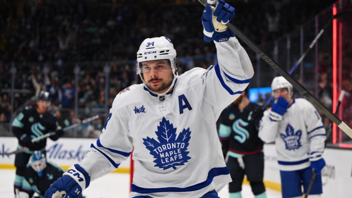 Jan 21, 2024; Seattle, Washington, USA; Toronto Maple Leafs center Auston Matthews (34) celebrates after scoring a goal against the Seattle Kraken during the first period at Climate Pledge Arena. Mandatory Credit: Steven Bisig-USA TODAY Sports