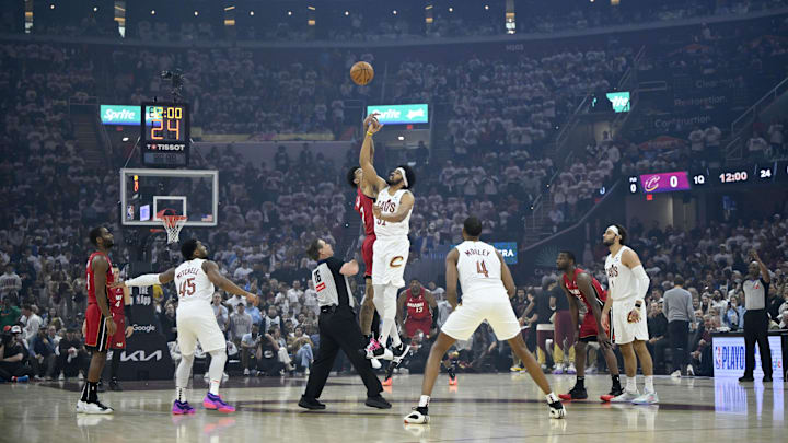 Apr 20, 2025; Cleveland, Ohio, USA; Cleveland Cavaliers center Jarrett Allen (31) jumps for the opening tip against the Miami Heat in the first quarter at Rocket Arena. Mandatory Credit: David Richard-Imagn Images