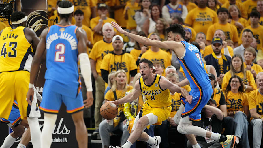 T.J. McConnell dribbles the ball past Chet Holmgren during Game 6 of the NBA Finals.