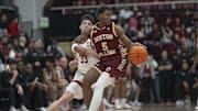 Feb 26, 2025; Stanford, California, USA;  Boston College Eagles guard Fred Payne (5) avoids Stanford Cardinal forward Evan Stinson (33) during the first half at Maples Pavilion. Mandatory Credit: Stan Szeto-Imagn Images