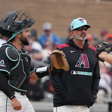 Mar 3, 2025; Salt River Pima-Maricopa, Arizona, USA; Arizona Diamondbacks manager Torey Lovullo (17) takes out pitcher Corbin Burnes (39) in the third inning against the Chicago Cubs at Salt River Fields at Talking Stick. Mandatory Credit: Rick Scuteri-Imagn Images