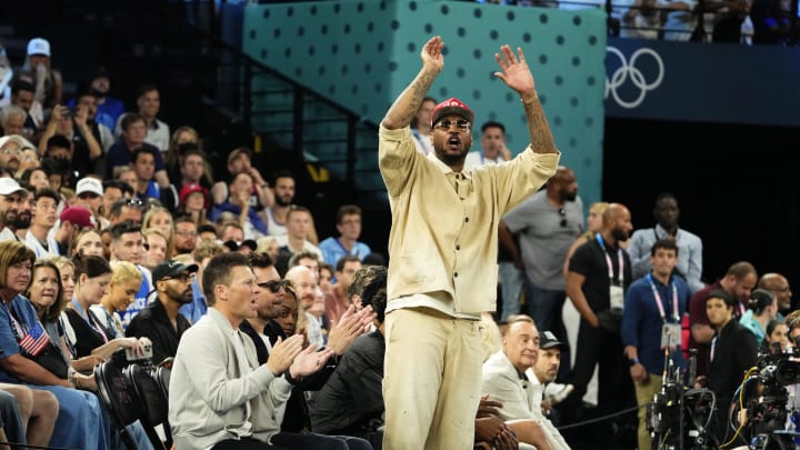 Aug 10, 2024; Paris, France; Carmelo Anthony cheers in the second half against France in the men's basketball gold medal game during the Paris 2024 Olympic Summer Games at Accor Arena. Mandatory Credit: Rob Schumacher-USA TODAY Sports