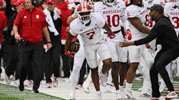 Oct 11, 2025; Eugene, Oregon, USA; Indiana Hoosiers defensive back Louis Moore (7) reacts after intercepting a pass tipped by defensive lineman Stephen Daley (8) against Oregon Ducks quarterback Dante Moore (5) during the fourth quarter at Autzen Stadium. Mandatory Credit: Troy Wayrynen-Imagn Images