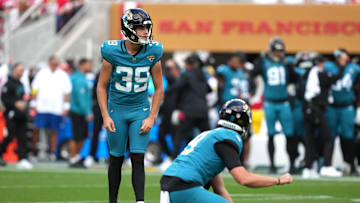 Sep 28, 2025; Santa Clara, California, USA; Jacksonville Jaguars kicker Cam Little (39) prepares to kick an extra point with punter Logan Cooke (foreground) during the second quarter against the San Francisco 49ers at Levi's Stadium. Mandatory Credit: Darren Yamashita-Imagn Images