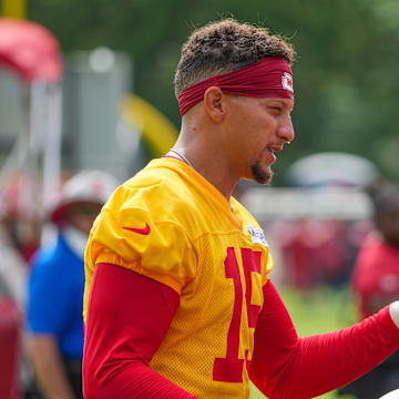 Jul 22, 2025; St. Joseph, MO, USA; Kansas City Chiefs quarterback Patrick Mahomes (15) signs autographs for fans after training camp at Missouri Western State University. Mandatory Credit: Denny Medley-Imagn Images