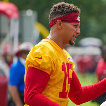 Jul 22, 2025; St. Joseph, MO, USA; Kansas City Chiefs quarterback Patrick Mahomes (15) signs autographs for fans after training camp at Missouri Western State University. Mandatory Credit: Denny Medley-Imagn Images