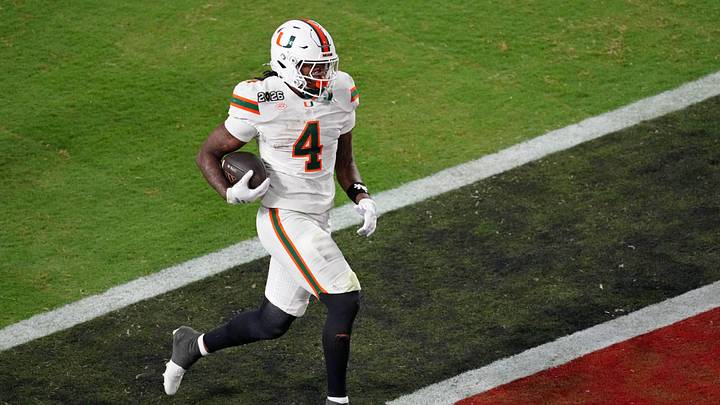 Jan 19, 2026; Miami Gardens, FL, USA; Miami Hurricanes running back Mark Fletcher Jr. (4) runs with the ball for a touchdown against the Indiana Hoosiers during the second half of the College Football Playoff National Championship game at Hard Rock Stadium. Mandatory Credit: James Lang-Imagn Images