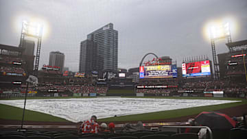 Jul 27, 2024; St. Louis, Missouri, USA; The tarp covers the field during a rain delay ahead of a game between the St. Louis Cardinals and the Washington Nationals at Busch Stadium. Mandatory Credit: Jeff Le-Imagn Images